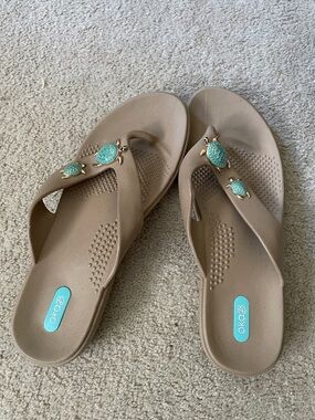 OKA b. Tan Sandal Flip Flops with Turquoise Turtle Charms